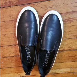 black calvin klein slip ons.